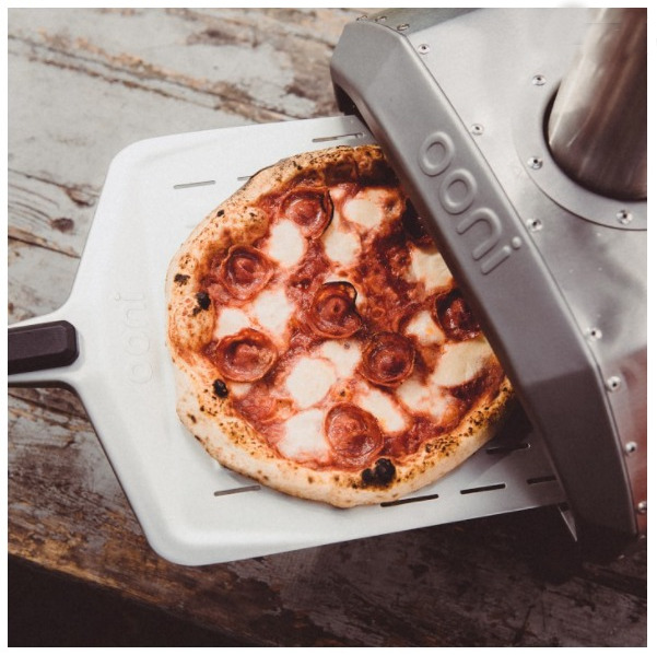 Portable Pizza Oven by OONI cooks wood-fired, stone-baked pizza in 60 seconds